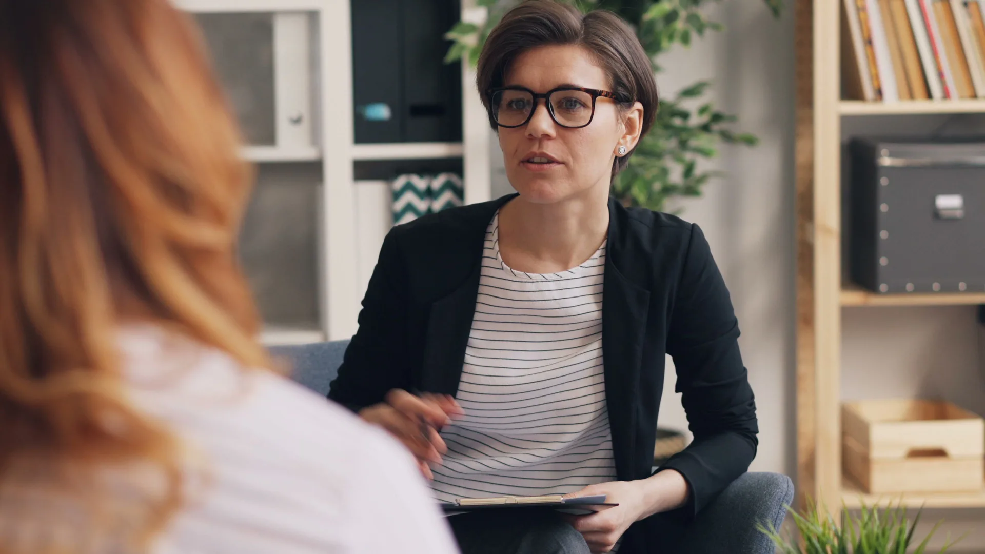 Health educator speaking with a client during a consultation