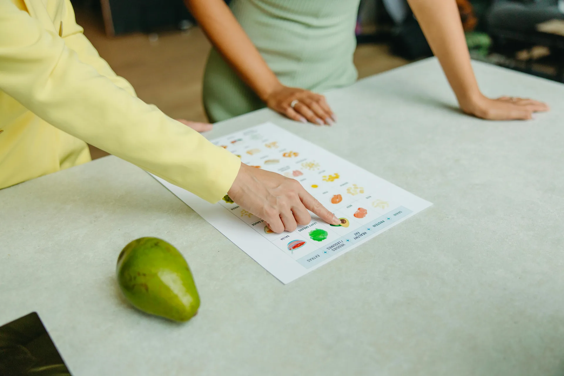 A nutrition professional consulting with a client