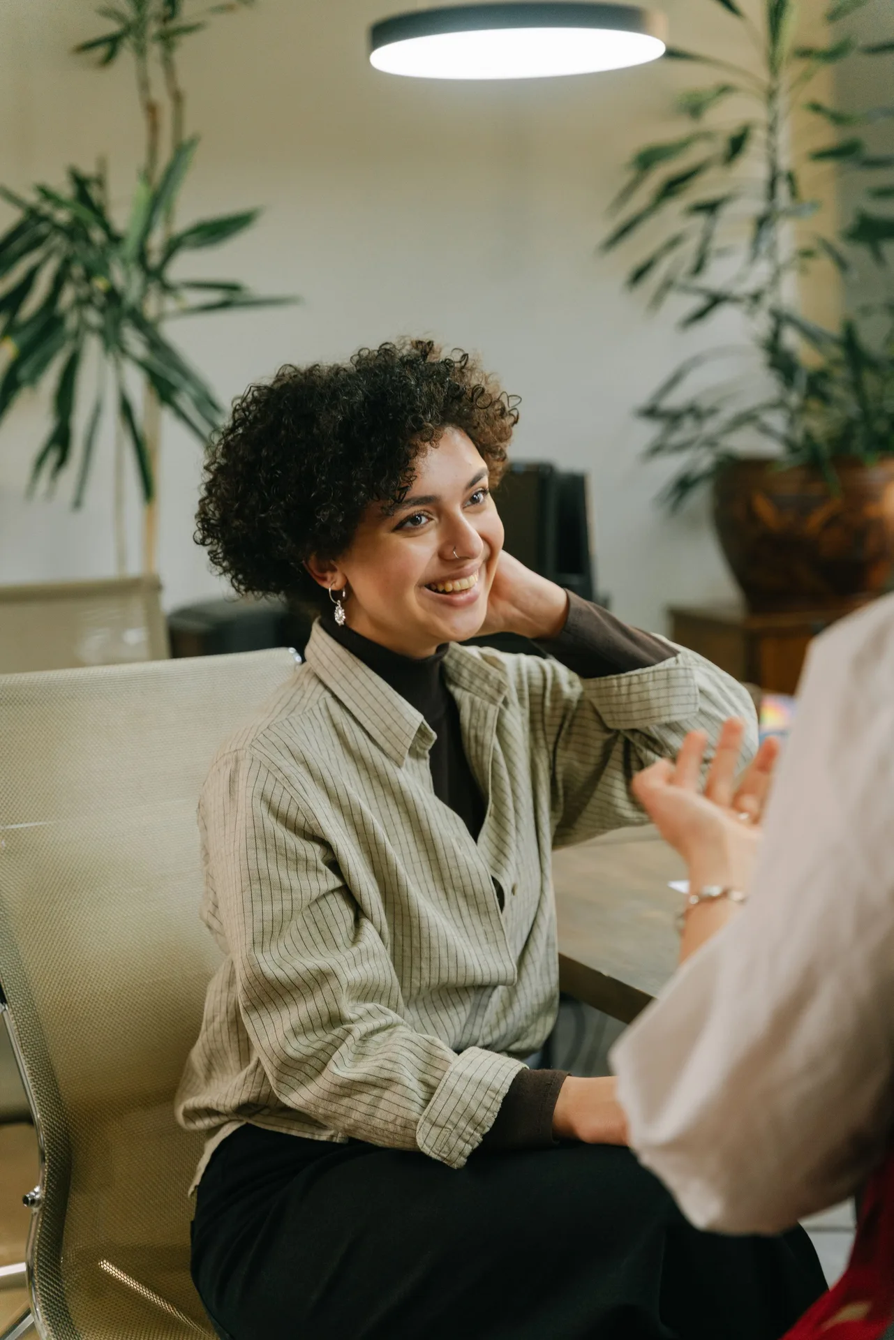 Client speaking with a practitioner in a wellness setting