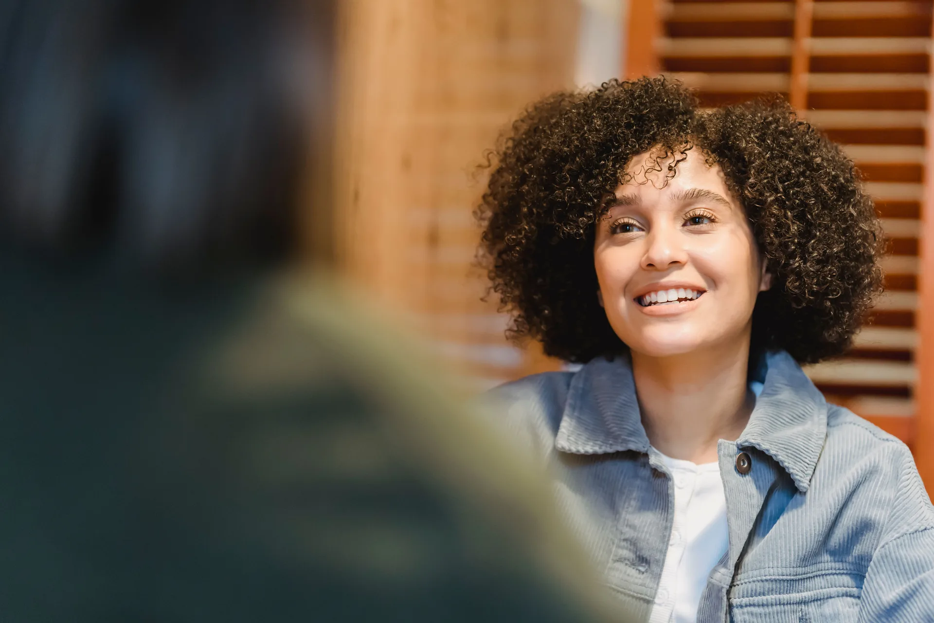 Practitioner speaking with a client in a consultation setting